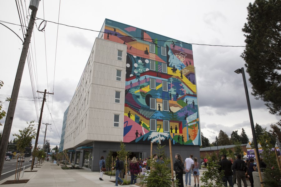 Fourth Plain Community Commons building on a grey cloudy day, featuring a colorful mural painted by local artists.